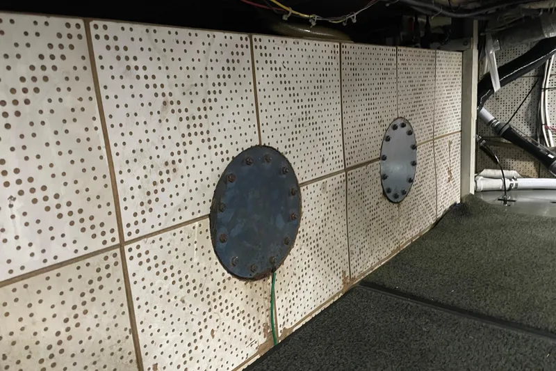 Slide: The Image of Interior of 1981 Cheer Men PT 38 Europa with perforated panels and circular metal covers. - 60