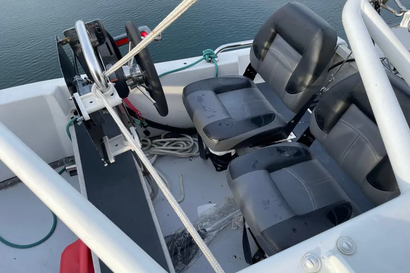 Slide: The Image of Interior of 1981 Cheer Men PT 38 Europa boat with steering wheel and seats. - 8