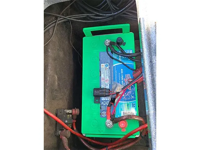 Slide: The Image of Green marine battery installed in a 2006 Ranger Z19 Comanche boat. - 2