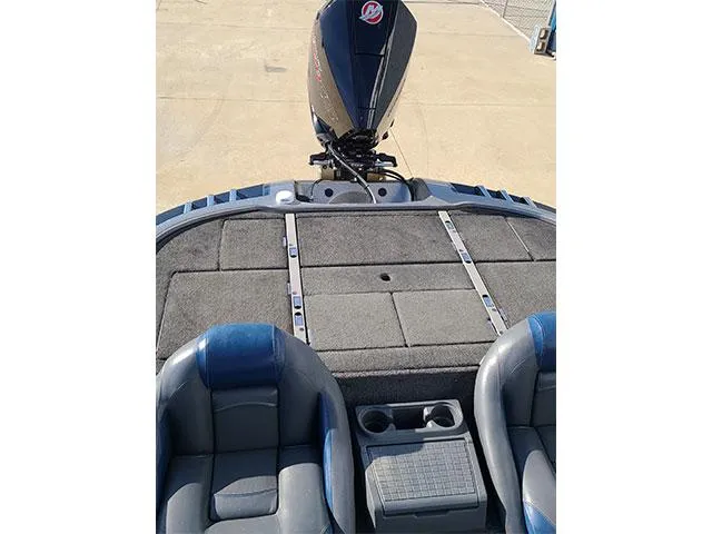 Slide: The Image of 2006 Ranger Z19 Comanche boat interior with seating and motor view. - 3