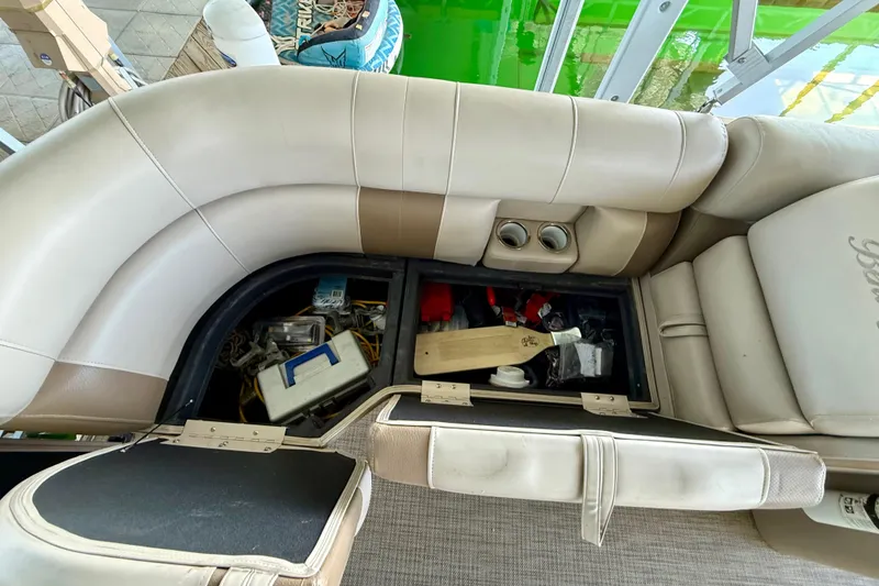 Slide: The Image of Storage compartment in a 2017 Bentley Pontoons 223 Cruise, revealing various boating accessories. - 14