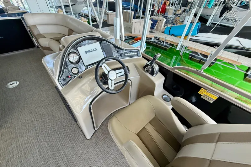 Slide: The Image of 2017 Bentley Pontoons 223 Cruise interior with steering console and seating. - 7