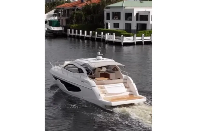 Slide: The Image of 2024 Sessa Marine C44 Cruiser on water, rear view, luxury yacht cruising. - 1