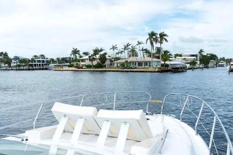 Slide: The Image of Luxurious cabin interior of 2024 Sessa Marine C44 Cruiser with plush bedding. - 13