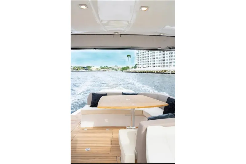 Slide: The Image of Luxurious 2024 Sessa Marine C44 Cruiser cabin with cozy bedding and ambient lighting. - 7