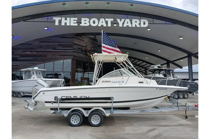 The Image of Century 2300 Walk-Around 1999 boat on trailer at The Boat Yard dealership. - 0