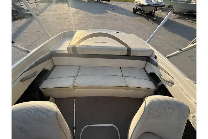 Slide: The Image of 2008 Bayliner 185 Bowrider interior with cushioned seating and open deck layout. - 10