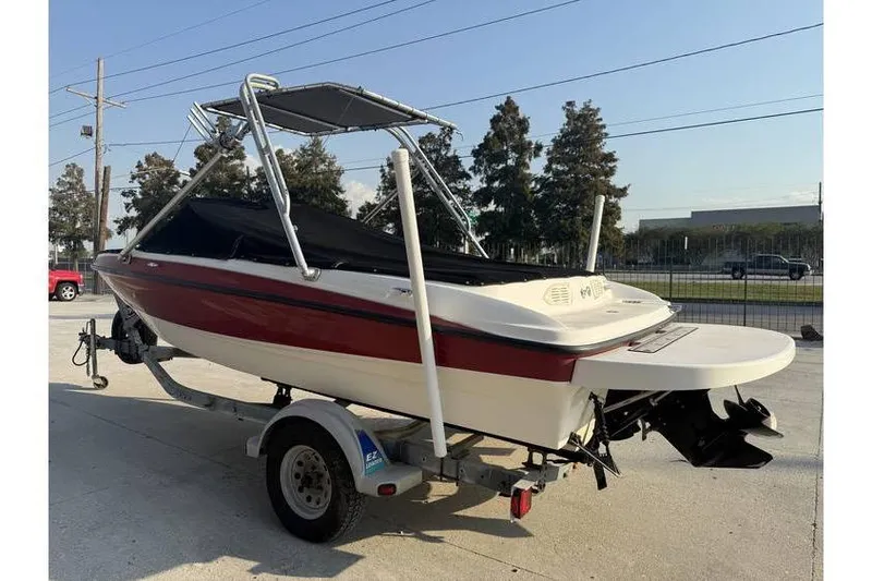 Slide: The Image of 2008 Bayliner 185 Bowrider on trailer, red and white, with canopy and cover. - 3
