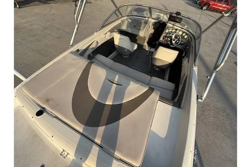 Slide: The Image of 2008 Bayliner 185 Bowrider interior with seating and dashboard view. - 6