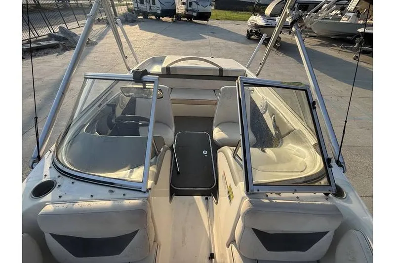 Slide: The Image of 2008 Bayliner 185 Bowrider interior with open windshield and seating area. - 7