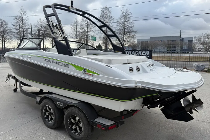 Slide: The Image of 2019 Tahoe 700 boat on trailer, sleek design with black and white exterior. - 5