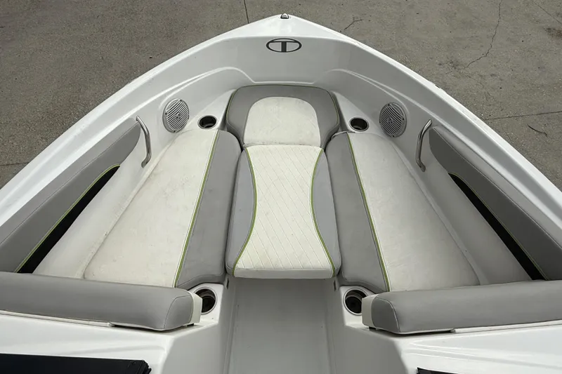 Slide: The Image of Bow seating area of a 2019 Tahoe 700 boat with cushioned seats and speakers. - 9