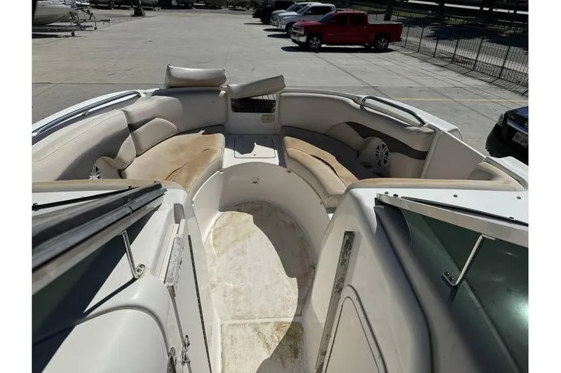 Slide: The Image of 2004 Chaparral Sunesta 254 boat interior with spacious seating and storage compartments. - 12