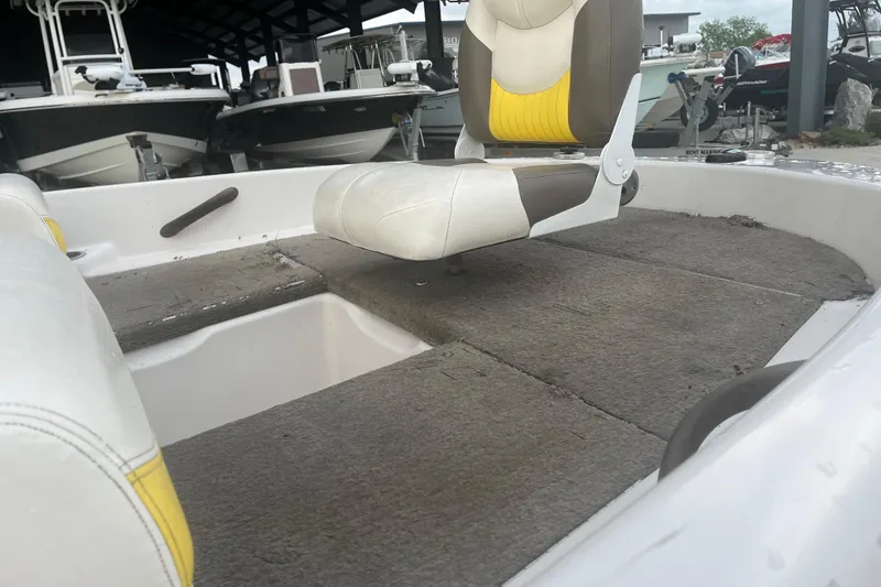 Slide: The Image of 2006 Nitro 189 Sport boat interior with seating and carpeted deck. - 11