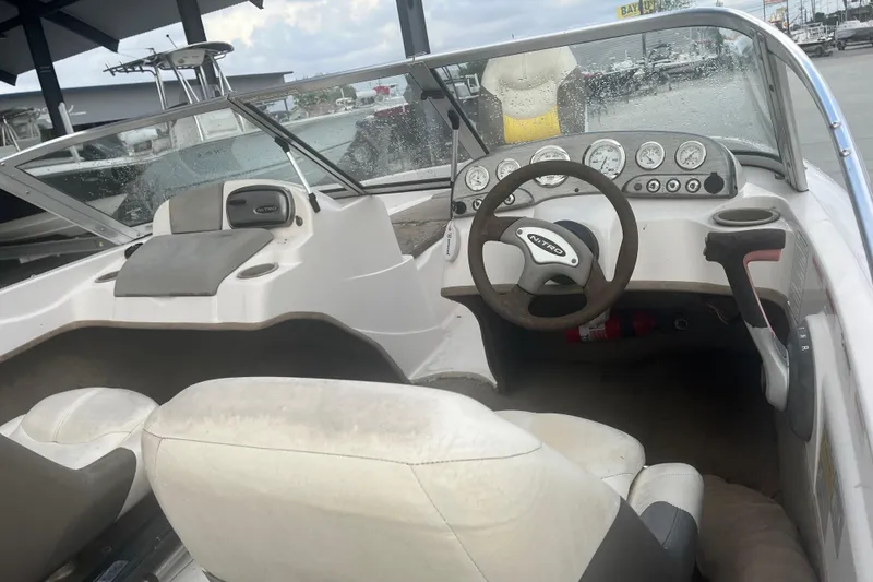 Slide: The Image of Interior of a 2006 Nitro 189 Sport boat with steering wheel and dashboard. - 9