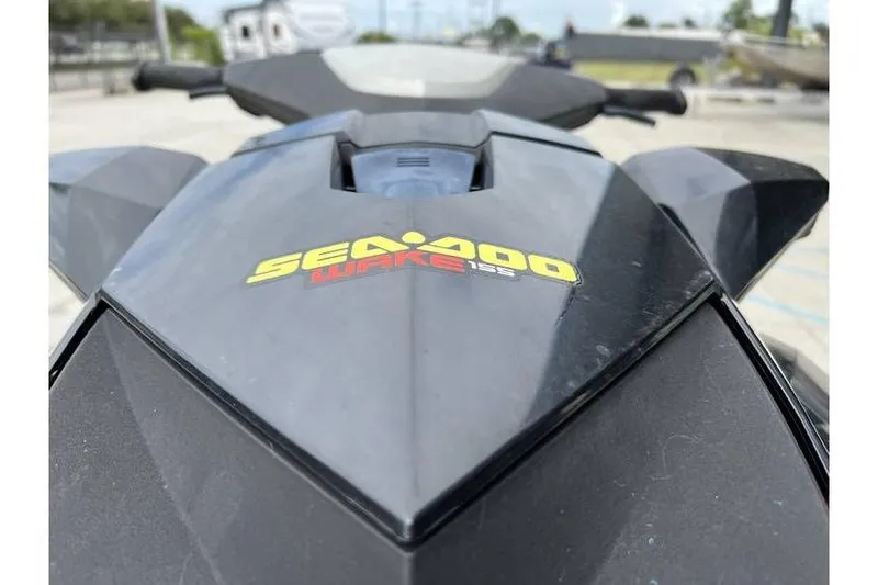 Slide: The Image of 2014 Sea-Doo Wake 155 jet ski, close-up of logo and design. - 11