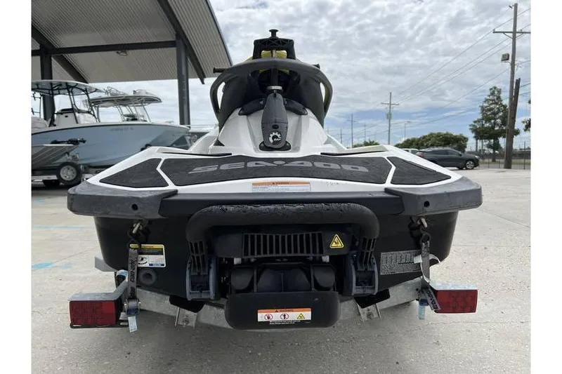 Slide: The Image of 2014 Sea-Doo Wake 155 jet ski rear view, parked on a trailer. - 6