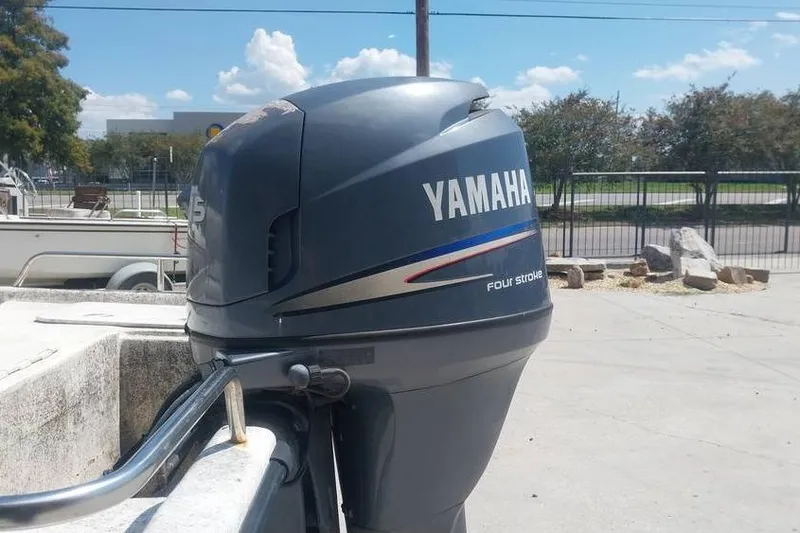 Slide: The Image of Yamaha four-stroke outboard motor on 2007 SeaStar 18cc boat, outdoor setting. - 7