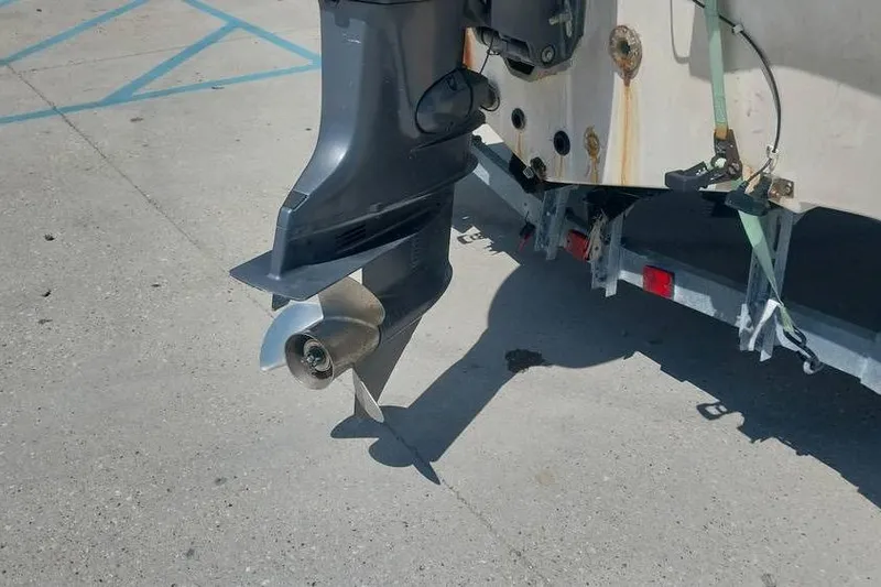 Slide: The Image of Outboard motor of a 2007 SeaStar 18cc boat on a trailer. - 8