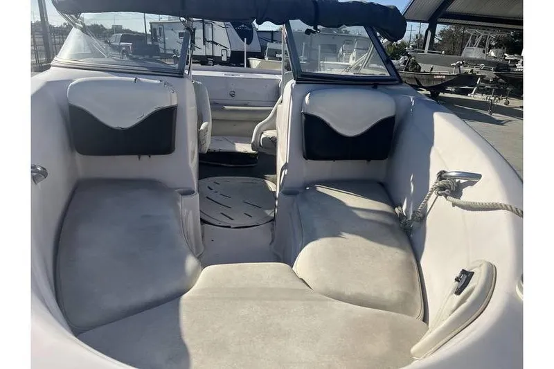 Slide: The Image of Interior view of a 2006 Tahoe 206 boat, featuring spacious seating and a clean design. - 8