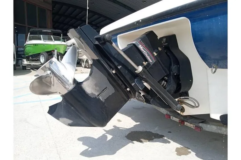 Slide: The Image of 2008 Bayliner 175 boat with MerCruiser outdrive in a marina setting. - 11