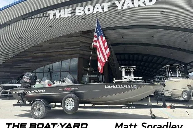 The Image of 2015 Tracker Pro Team 190 TX boat with American flag at The Boat Yard. - 0
