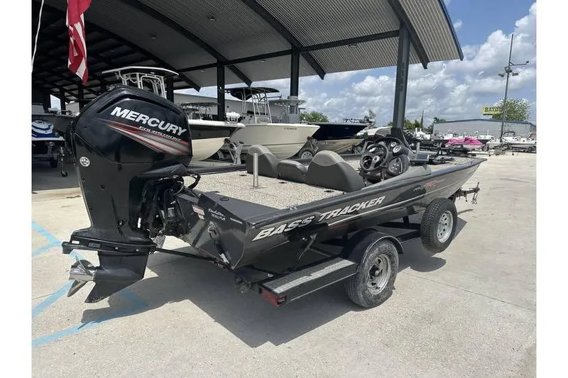 Slide: The Image of 2015 Tracker Pro Team 190 TX boat with Mercury outboard motor on trailer. - 4