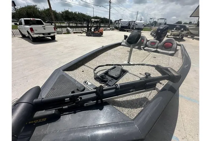 Slide: The Image of 2015 Tracker Pro Team 190 TX fishing boat in a parking lot. - 6