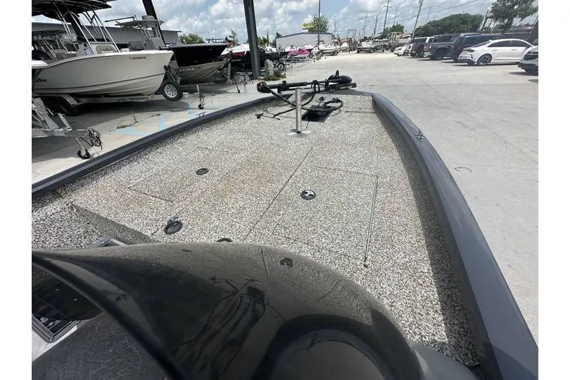 Slide: The Image of 2015 Tracker Pro Team 190 TX boat on display at a dealership. - 8