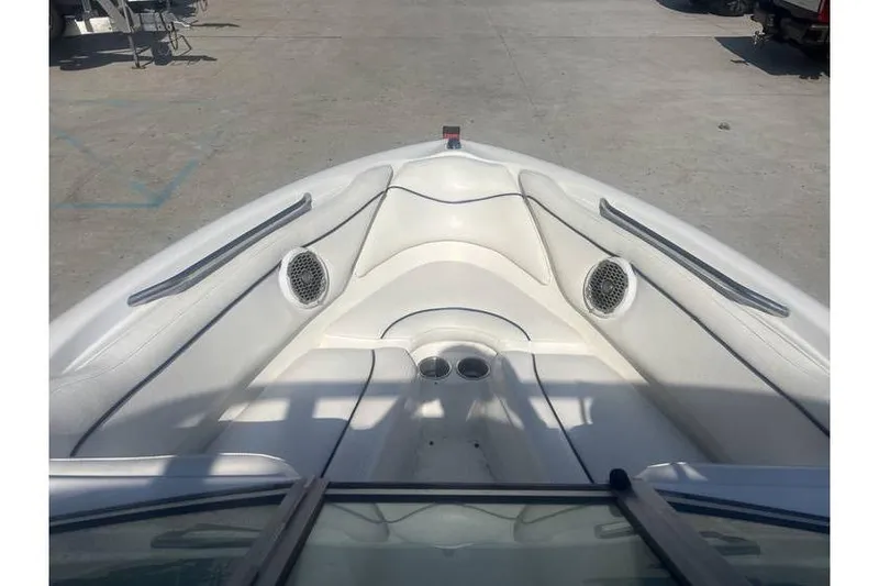 Slide: The Image of 1999 MasterCraft Prostar 205 boat interior with white seating and cup holders. - 6