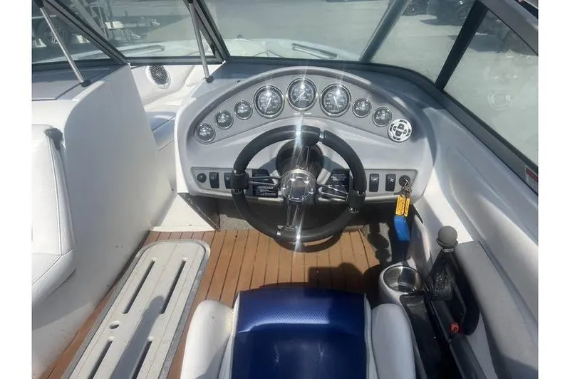 Slide: The Image of 1999 MasterCraft Prostar 205 boat dashboard with steering wheel and gauges. - 9