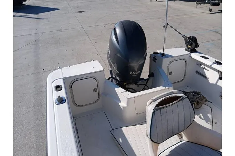 Slide: The Image of Trophy 1800 boat, 2000 model, featuring a 150 HP outboard motor and seating area. - 11