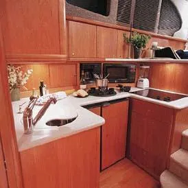 Slide: The Image of 2003 Silverton 38 Convertible helm with navigation equipment and steering wheel. - 29