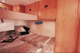 Slide: The Image of 2003 Silverton 38 Convertible boat helm with dual seats and steering wheel. - 31