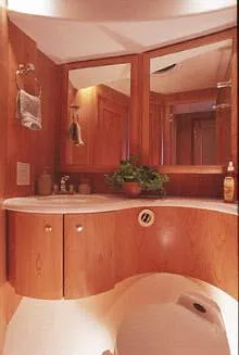 Slide: The Image of 2003 Silverton 38 Convertible boat interior with white seating and fishing net. - 32