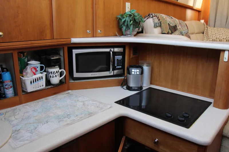 Slide: The Image of 2003 Silverton 38 Convertible kitchen with microwave, stove, and coffee maker. - 41