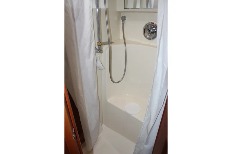 Slide: The Image of Shower area in 2003 Silverton 38 Convertible yacht with curtain and handheld showerhead. - 51