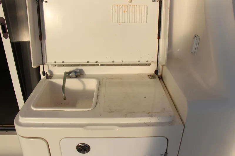 Slide: The Image of 2003 Silverton 38 Convertible boat sink and counter area. - 61
