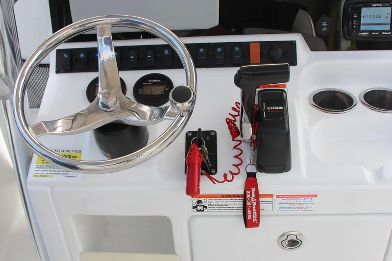 Slide: The Image of Steering console of 2019 Sea Hunt Triton 210 boat with Yamaha controls and gauges. - 21