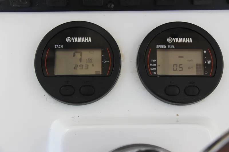 Slide: The Image of Yamaha gauges on 2019 Sea Hunt Triton 210, displaying tachometer and fuel consumption. - 23