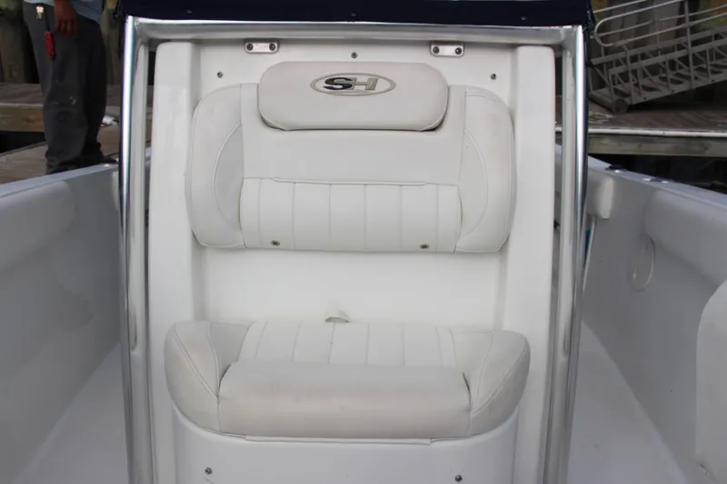 Slide: The Image of 2019 Sea Hunt Triton 210 boat seat with white cushioned upholstery. - 33
