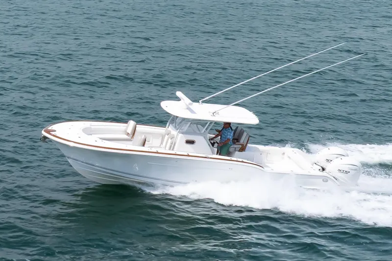 The Image of 2026 Buddy Davis 34 Center Console boat cruising on open water. - 1