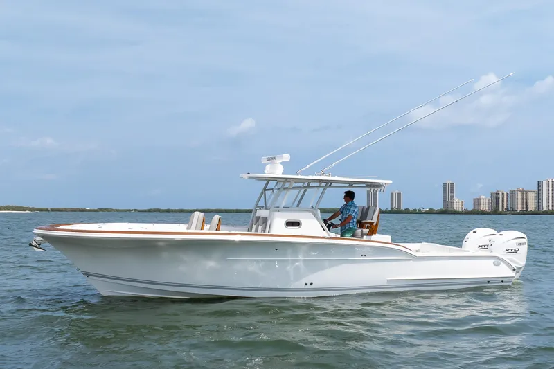 Slide: The Image of 2026 Buddy Davis 34 Center Console boat cruising on open water. - 10