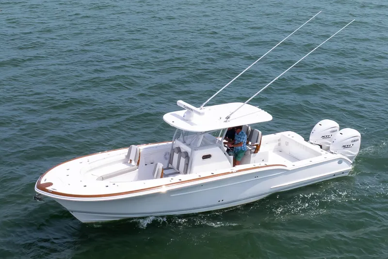 Slide: The Image of 2026 Buddy Davis 34 Center Console boat cruising on open water. - 17