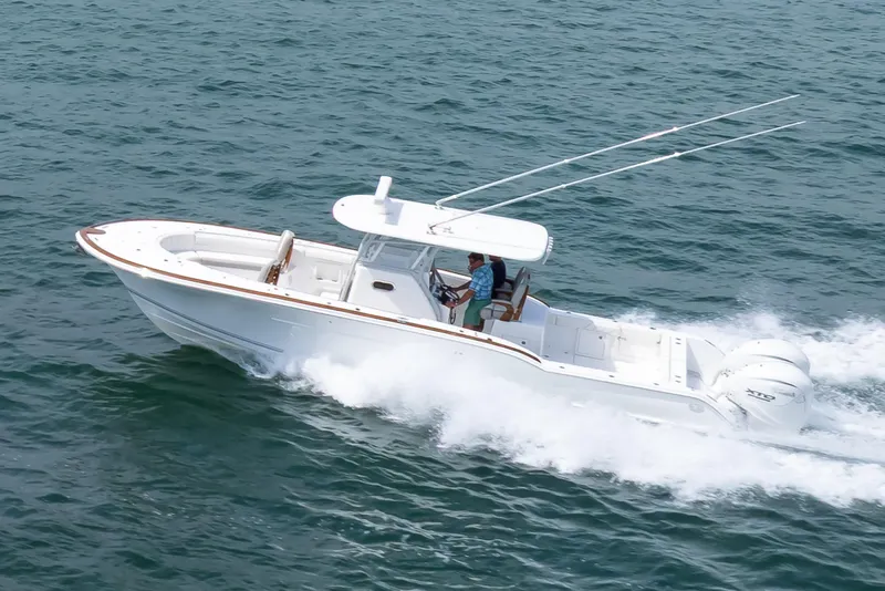 Slide: The Image of 2026 Buddy Davis 34 Center Console boat cruising on open water. - 20