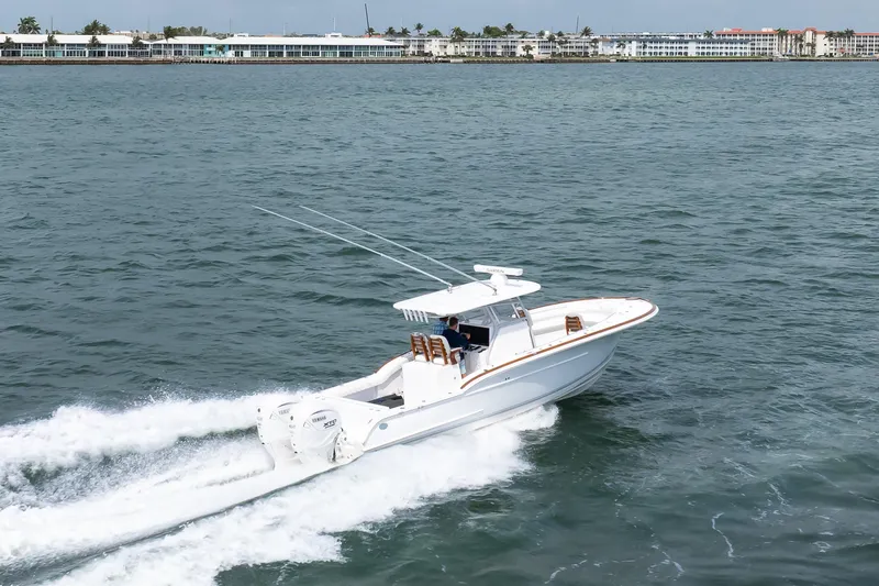 Slide: The Image of 2026 Buddy Davis 34 Center Console boat cruising on open water. - 29
