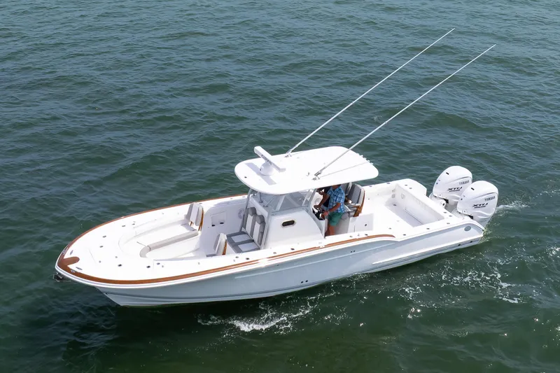 Slide: The Image of 2026 Buddy Davis 34 Center Console boat cruising on open water. - 3