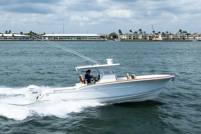 Slide: The Image of 2026 Buddy Davis 34 Center Console boat cruising on the water. - 33