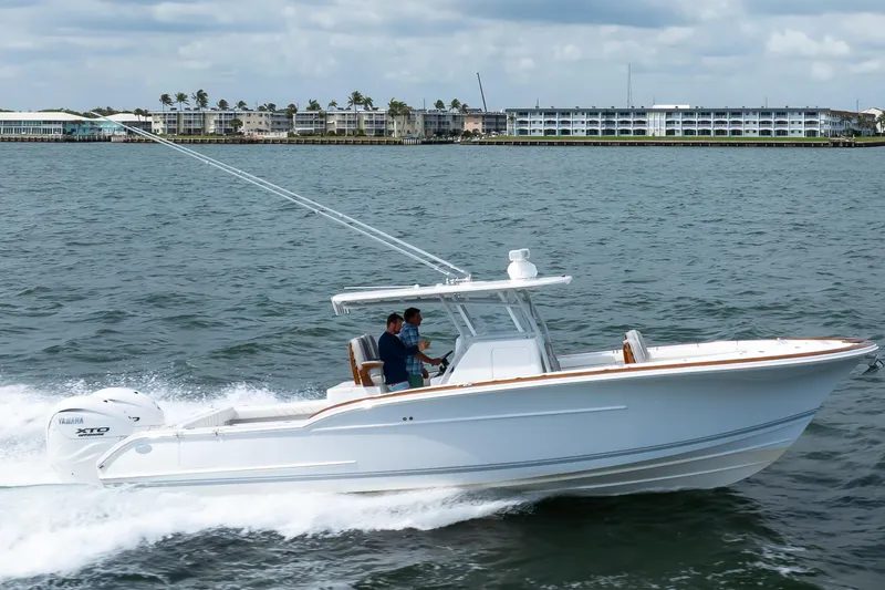 Slide: The Image of 2026 Buddy Davis 34 Center Console boat cruising on open water. - 38