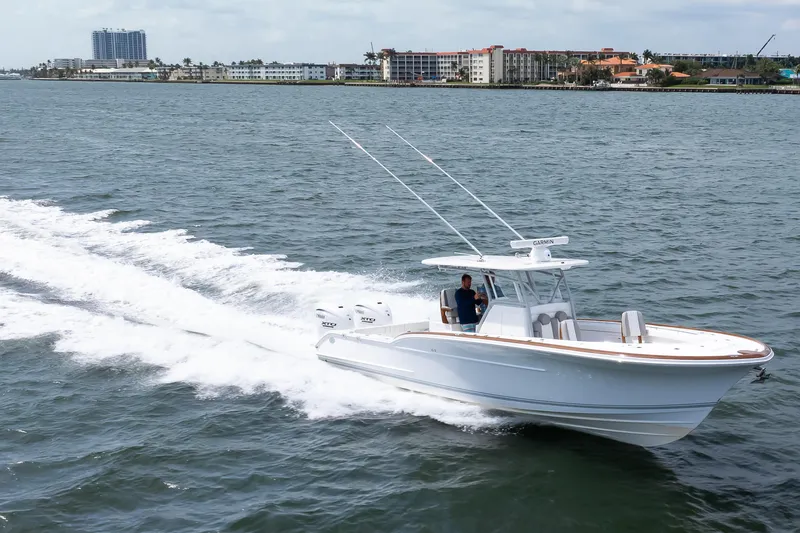 Slide: The Image of 2026 Buddy Davis 34 Center Console boat cruising on open water. - 39